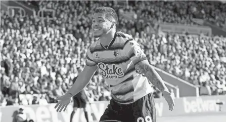  ?? KIERAN CLEEVES/AP ?? Watford's Cucho Hernandez celebrates scoring against Southampto­n on March 13.