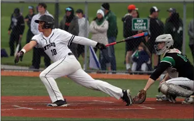  ?? RANDY MEYERS — FOR THE MORNING JOURNAL ?? Brendan Holley of Elyria Catholic lines a hit to center field against Holy Name on Monday May 20at the district semi final