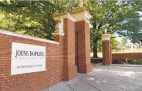  ?? BALTIMORE SUN STAFF ?? Brick columns mark the east entrance to the Johns Hopkins University Homewood campus.