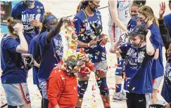  ?? MORRY GASH/ASSOCIATED PRESS ?? UConn head coach Geno Auriemma is dunked with confetti after the Huskies defeated Baylor in an Elite Eight game of the Women’s NCAA Tournament on Monday.