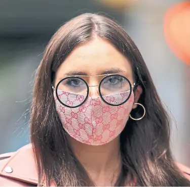  ?? GOTHAM GETTY IMAGES ?? With disease swirling, do face masks have a right to become style signifiers?