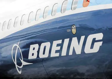  ?? —REUTERS ?? BLUE BROADSIDE Boeing won regulatory approval for the 737 MAX, shown here, to return to the skies after fatal crashes.