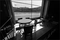  ?? ASSOCIATED PRESS ?? THIS JUNE 25 PHOTO shows the view of the baseball field at Fenway Park from the Bleacher Bar in Boston. Located inside the outfield structure at Fenway, it might be one of the few places where fans can watch live MLB baseball this year. Like the Knothole Gangs of the sport’s early days, fans hoping to catch a glimpse of a ballgame in person this season will be pressing their faces up against hotel windows, peering through metal grates or clambering up to rooftops when baseball returns this month in otherwise empty stadiums.