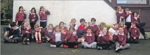  ??  ?? Above: Whiting Bay pupils in the playground with their Buddy Bears.