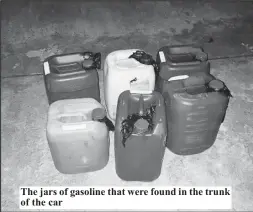  ??  ?? The jars of gasoline that were found in the trunk of the car