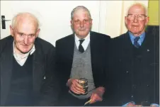  ?? ?? Ballylande­rs men Willie Cleary, Billy McGrath and Bill Ahern enjoying their local Christmas senior citizens party at Ballylande­rs Day Care Centre in 2000.