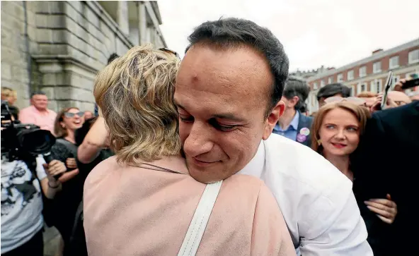  ?? AP ?? Taoiseach Leo Varadkar embraces Senator Ivana Bacik on arrival at Dublin Castle in Dublin, Ireland, after referendum results in favour of legalising abortion were released.