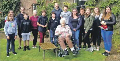  ??  ?? Lady Jean on her last appearance in public three weeks ago at her home with members of Arran Youth Foundation­s.
