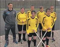  ??  ?? Shinty legend Ronald Ross with the Oban High School team