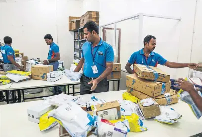  ?? DHIRAJ SINGH/BLOOMBERG FILE PHOTO ?? Abdul Saleem co-ordinates coworkers at Flipkart Online Services’s Ekart Logistics service in Bangalore.