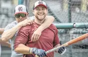  ?? EMILY CURIEL ecuriel@kcstar.com ?? Kansas City Monarchs manager Joe Calfapietr­a, left, and infielder Cameron Cannon are seen during batting practice at Legends Field on Wednesday in Kansas City, Kansas.