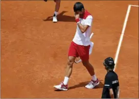  ?? PAUL WHITE — THE ASSOCIATED PRESS ?? Novak Djokovic of Serbia reacts during his match against Kyle Edmund of Britain during the Madrid Open Tennis tournament in Madrid, Spain, Wednesday.