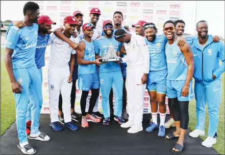  ?? (AP) ?? The West Indies team poses with the Wisden trophy after day four of the third cricket Test match against England at the Daren Sammy Cricket Ground in Gros Islet, St Lucia on Feb 12. West Indies won the series 2-1.