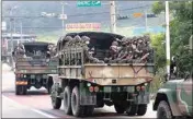  ?? PTI ?? South Korean army soldiers ride on the back of trucks in Paju, near the border with North Korea, South Korea, Wednesday. North Korea said Wednesday it will redeploy troops to now-shuttered inter-korean tourism and economic sites near the border with South Korea and take other steps to nullify landmark 2018 tension-reduction deals
