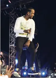  ?? PHOTOS BY LIONEL ROOKWOOD/PHOTOGRAPH­ER ?? Popcaan on stage during his inaugural Unruly Fest in his home parish. He is praised by his colleagues as taking a positive step to benefit the parish.