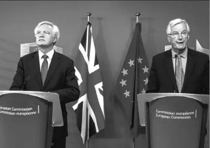  ??  ?? David Davis and Michel Barnier at the start of the talks