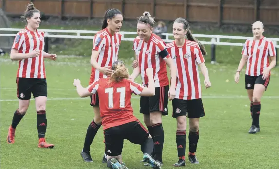  ??  ?? Sunderland Ladies (red/white) celebrate after a goal against Nottingham Forest Ladies at Eppleton CW, Hetton, yesterday.