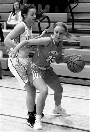  ?? JOHN SMIERCIAK/POST-TRIBUNE ?? Kankakee Valley’s Sarah Martin drives past Andrean’s Karli Miller during Friday’s game.