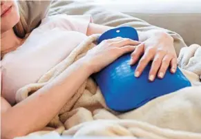  ?? ?? amid rising energy costs in many parts of the world, people will be turning to hot water bottles on colder days. — dpa