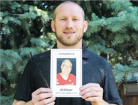  ?? BRANDON HARDER ?? Dave Driver holds a photograph of his father, Al Driver, a longtime employee of the Regina Leader-Post who passed away in 2016.