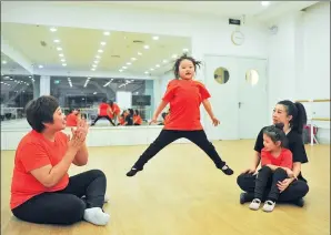  ?? PROVIDED TO CHINA DAILY ?? Zhang Haihan (left) and her club members at a mom-kid dancing rehearsal on March 7 in Shenyang, Liaoning province.