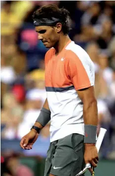  ?? AGENCE FRANCE PRESSE ?? Rafael Nadal of Spain walks on the court while playing Alexandr Dolgopolov of Ukraine during the BNP Parabas Open at the Indian Wells Tennis Garden in Indian Wells, California.