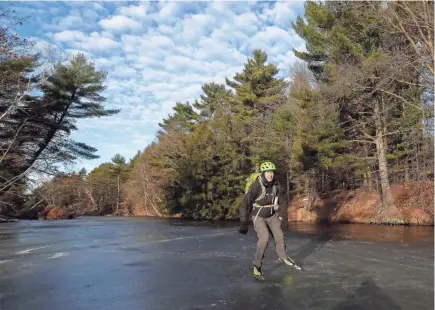  ?? TORK MASON/USA TODAY NETWORK-WISCONSIN ?? Rick Zahn skates on the Little Eau Claire River near Knowlton on Dec. 10.