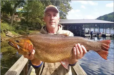  ?? Photo submitted ?? Mike Bowers of Abilene, Kan., caught the record-breaking Cutthroat trout, breaking a record held nearly 33 years, last weekend. Bowers said he has fished the North Fork of the White River for longer than the record had held and makes two or three trips to Arkansas’s northern trout streams each year.