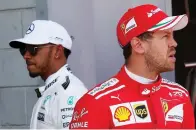  ?? (Reuters) ?? MERCEDES DRIVER Lewis Hamilton (left) called title rival Sebastian Vettel (right) of Ferrari ‘a disgrace’ after the German drove into the Briton’s car in Sunday’s F1 Azerbaijan Grand Prix in Baku.