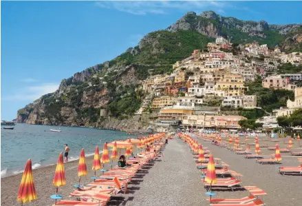  ?? RICK STEVES ?? Positano, the jewel of Italy’s Amalfi Coast, hugs the rugged shoreline.