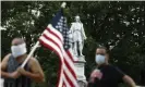  ?? Photograph: Matt Slocum/AP ?? People gather near the statue of Christophe­r Columbus in South Philadelph­ia on 15 June 2020.