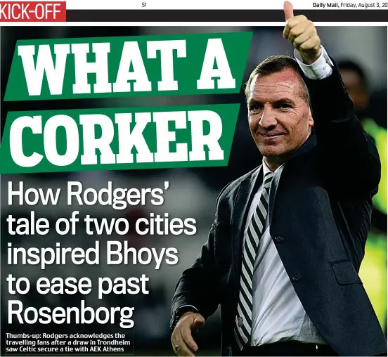  ??  ?? Thumbs-up: Rodgers acknowledg­es the travelling fans after a draw in Trondheim saw Celtic secure a tie with AEK Athens