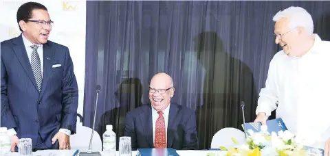  ?? Ricardo Makyn/Multimedia Photo Editor ?? CEO of Kingston Wharves Limited Grantley Stephenson (left) and directors Dr Marshall Hall (centre) and Charles Johnston share a joke at the company’s annual general meeting in Kingston on Thursday, June 22.