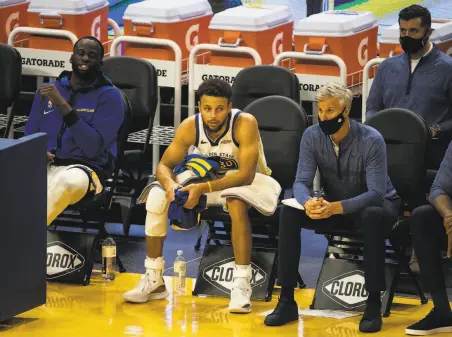  ?? Stephen Lam / Special to The Chronicle ?? Warriors guard Stephen Curry rides the bench, apparently out of answers, during the fourth quarter of Friday’s loss to the Trail Blazers. In his rivalry with Oakland native Damian Lillard of Portland, Curry was outscored 3426.