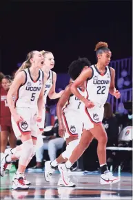  ?? Tim Aylen / Associated Press ?? UConn's Paige Bueckers (5) and teammates including Olivia Nelson-Ododa (20), far left, and Evina Westbrook (22), right, react during a loss to South Carolina at Paradise Island, Bahamas on Nov. 22.