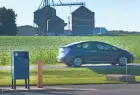  ?? MARK HOFFMAN / MILWAUKEE JOURNAL SENTINEL ?? A car passes by a mailbox in front of a post office in the unincorpor­ated Fond du Lac County community of Malone. The postal service was excluded from pandemic bailout money from Congress and has discussed scaling back service.