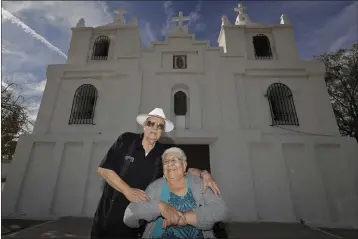  ?? MATT YORK — THE ASSOCIATED PRESS ?? Frank and Ester Cota pose for a photograph outside Our Lady of Guadalupe church on Friday in Guadalupe, Ariz. Guadalupe is named for Mexico’s patron saint,