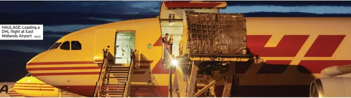  ?? ?? HAULAGE: Loading a DHL flight at East Midlands Airport