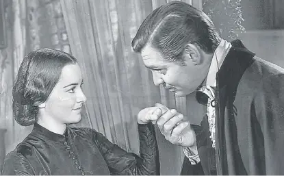  ?? SUN-TIMES LIBRARY ?? Olivia de Havilland and Clark Gable in “Gone With the Wind.” Born in Tokyo, she lived in Paris since the early 1950s.