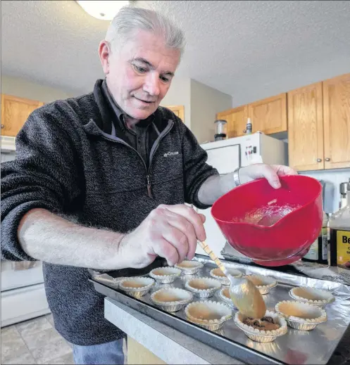  ?? CP PHOTO ?? Roger Marple, who was diagnosed with early-onset Alzheimer’s in 2015 at age 57, bakes butter tarts in his apartment in Medicine Hat, Alta., last Friday.