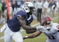  ?? BRANDON WADE - AP FILE ?? In this Oct. 20, 2018, photo, TCU wide receiver Jalen Reagor (1) catches a pass in the end zone for a touchdown as Oklahoma cornerback Parnell Motley (11) defends during an NCAA football game in Fort Worth, Texas. Reagor was selected by the Philadelph­ia Eagles in the first round of the NFL draft.