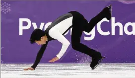  ?? DAVID J. PHILLIP / AP ?? Nathan Chen falls while performing during the short program figure skating Friday. Chen, 18, dropped from medal contention and finished fifth.