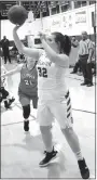  ?? Westside Eagle Observer/MIKE ECKELS ?? Savanna Dodson (Decatur 32) puts up a shot during the second quarter of the Decatur-Flippin conference basketball contest at Peterson Gym in Decatur Jan. 11. The Lady Bulldogs took the win, 49-48, over the Lady Bobcats.