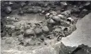  ??  ?? A photo shows parts of an Aztec tower of human skulls, believed to form part of the Huey Tzompantli, at the Templo Mayor archaeolog­y site, in Mexico City. Photograph: INAH/Reuters