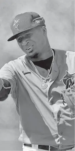  ?? JEFF ROBERSON/AP ?? Marlins pitcher Sixto Sanchez gestures while talking to a teammate during spring training practice in Jupiter on Feb. 26.