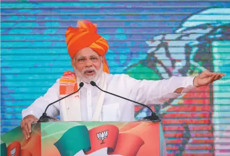  ?? AP PHOTO ?? Indian Prime Minister Narendra Modi speaks during a public meeting in Ajmer, in the western Indian state of Rajasthan, on Oct. 6.