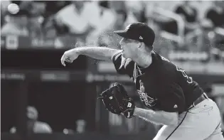  ?? THE ASSOCIATED PRESS ?? Atlanta’s Lucas Sims delivers a pitch during the second inning Monday in the first game of a doublehead­er in New York.