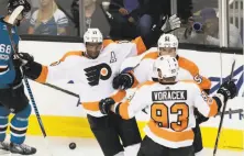  ?? Tony Avelar / Associated Press ?? The Flyers’ Wayne Simmonds (center) celebrates after scoring one of his two goals in the third period that fueled a hat trick.