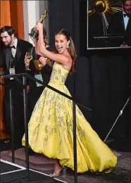  ?? PHOTO BY JORDAN STRAUSS/INVISION/AP ?? Alicia Vikander poses with the Oscar for best actress in a supporting role for “The Danish Girl” in the press room at the Oscars on Sunday in Los Angeles.