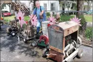  ?? (NWA Democrat-Gazette/Megan Davis) ?? Ed Malcom is pictured with a small portion of his antique Le Roi engine collection at his home in Pineville, Mo.